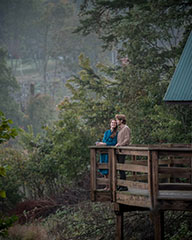 people looking off of a mountain overlook